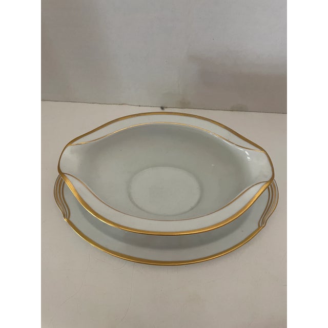 Vintage Heritage China porcelain gravy boat with underplated hand painted and beautiful. Marked on the bottom. Serve your...