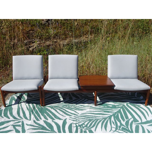 Teak lounge set comprising a three-seater sofa and a modular coffee table. Model Saga, Norwegian manufacture, 1960s, by...