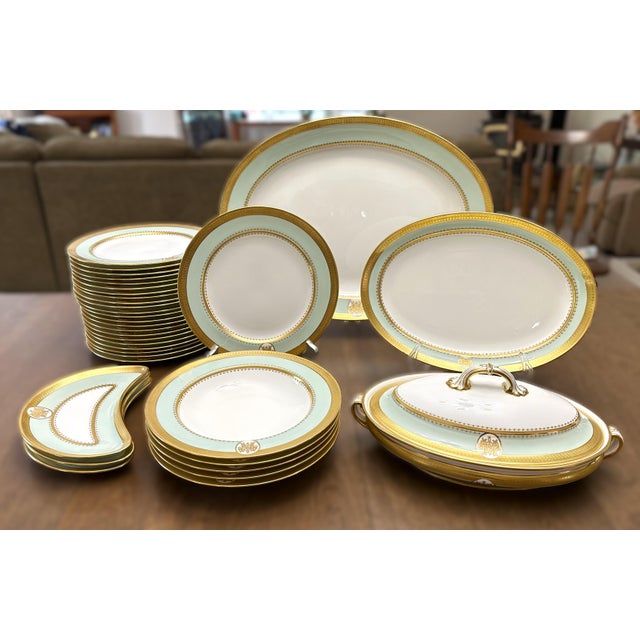 Magnificent, extensive antique Minton porcelain partial dinner service, dating back to 1884. This luxurious set features a...