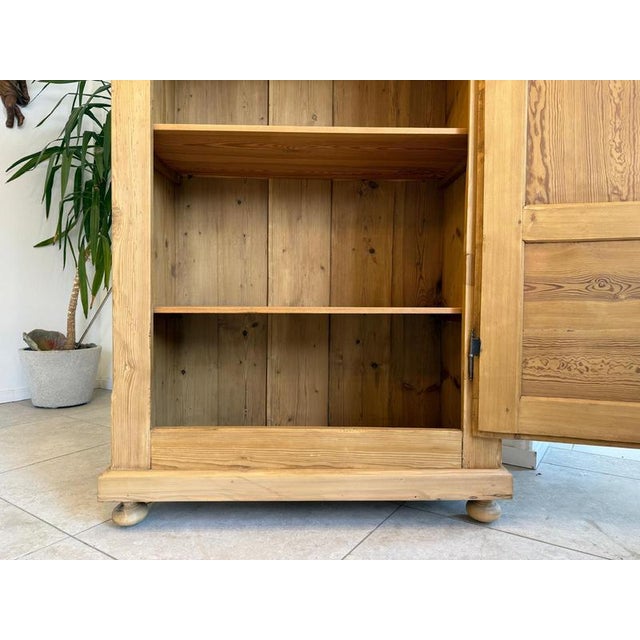 Restored antique farmhouse cupboard, natural wood, from the Biedermeier period. Dimensions: Height x Width x Depth 180 x...