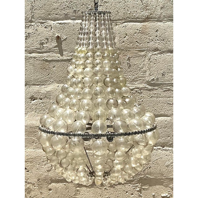 Illuminate your space with the ethereal glow of this stunning vintage chandelier, a captivating "Ariel" inspired piece...