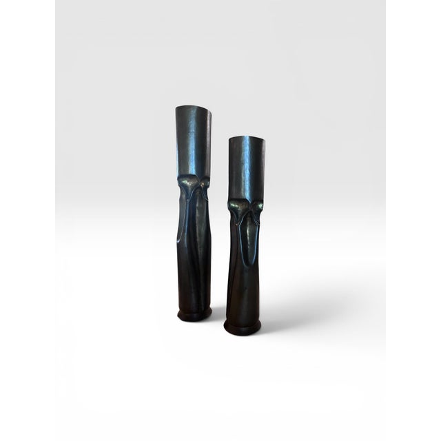 A dramatic pair of Mid-Century Modern Brutalist candleholders crafted in patinated bronze. Featuring hand-worked surfaces...