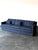 Clean mid-century modern lines meet a deep blue jacquard on this vintage track arm sofa. Low, boxy arms frame the seat,...