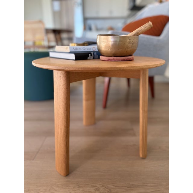 Medium Alle Coffee Table by Staffan Holm, crafted in solid natural oak. Its circular shape, softly rounded edges, and...