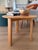 Medium Alle Coffee Table by Staffan Holm, crafted in solid natural oak. Its circular shape, softly rounded edges, and...