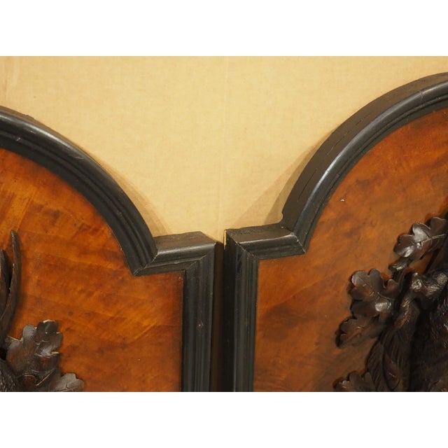 Hand-carved in France during the early 1900s, this pair of hunt plaques feature raised game carvings on each panel, backed...
