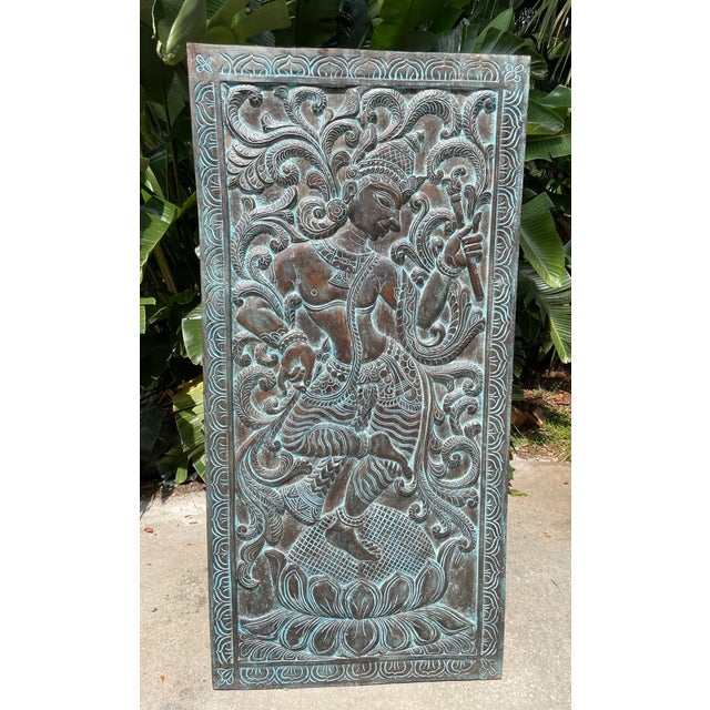 Vintage Wall Decor Panel, featuring a detailed carving of Dancing Krishna, the Hindu deity known for joy, love, and music....