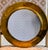 Elevate your wall décor with this striking vintage round mirror by Design International of Oakland, California,...