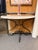 This elegant vintage demi-lune (half-moon) console table features a beautifully veined white/cream marble top paired with...