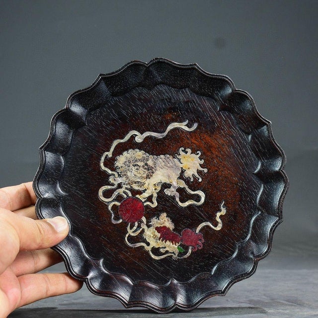 This elegant scalloped wooden tray features a traditional Chinese "Foo Lions Playing Ball" design, skillfully inlaid with...