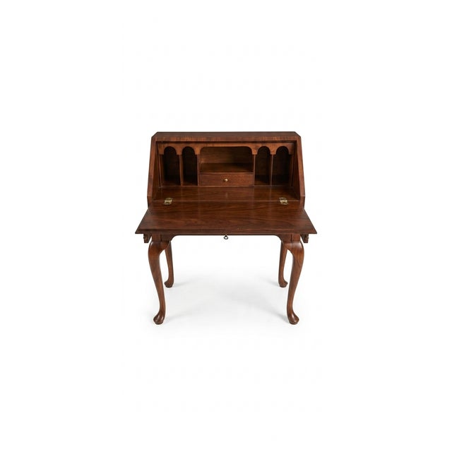 Bakers Furniture The desk features burled walnut veneer (burl wood), prized for its intricate, swirled grain patterns,...