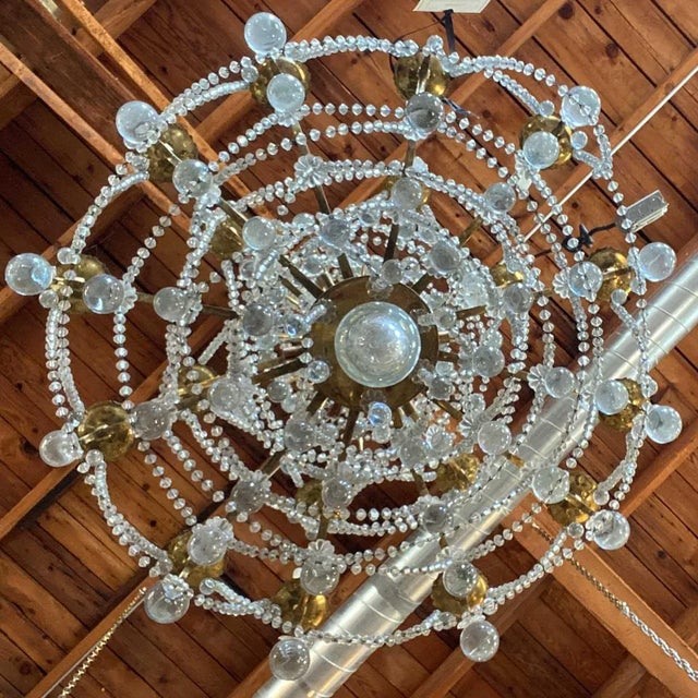 DETAILS Rising on a central, crystal fount, this very large antique French chandelier features three upper tiers in...