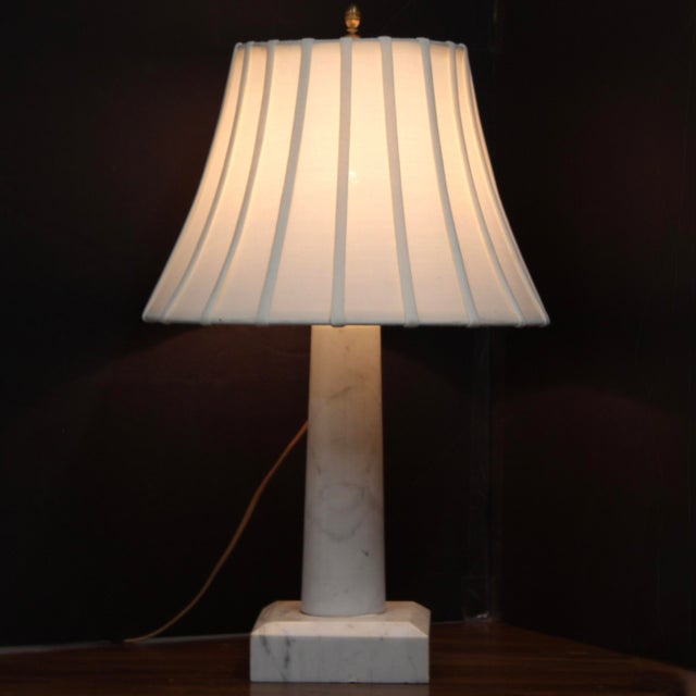 Beautiful 1950s table lamp has a tapered, solid marble column body atop a stepped square marble base, finished with...