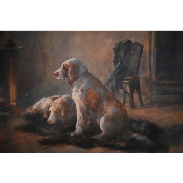 This dogs at home watercolor and gouache painting of two setters by a fire is by British artist, illustrator, and etcher,...