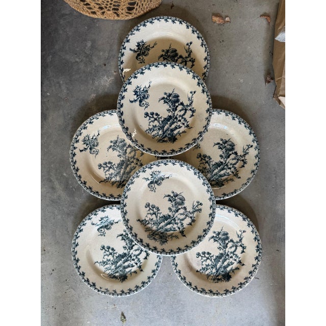 Set of seven French Transferware plates by Gien. 9.5”dia 49-144