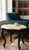 Elegant vintage accent table featuring a richly carved dark mahogany-finish wood base with classic Rococo-inspired...