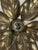 A brass floral florentine wall sconce attributed often to willy daro for massive lighting, belgium 1970s. This iconic wall...