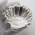 An elegant vintage object depicting a small raised bowl in the shape of a shell, handcrafted in Palermo, Sicily, Italy...