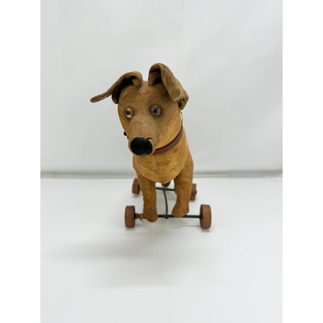A rare and finely constructed early 20th-century German pull toy dog, attributed to the Steiff company or a Thuringian...