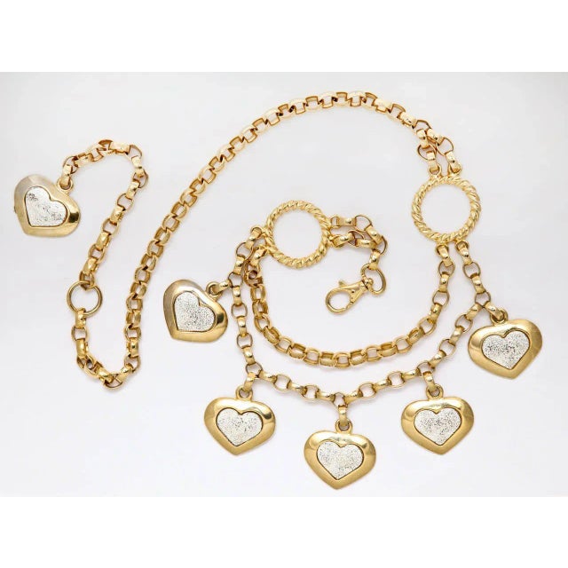 This is part of Chairish’s Costume Jewelry assortment. 1980's goldtone Italian chain belt from Neiman Marcus. Hearts have...