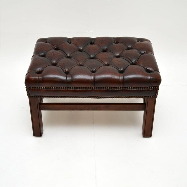 A fantastic antique leather stool. This is in the classic Chippendale style, it was made in England and dates from around...