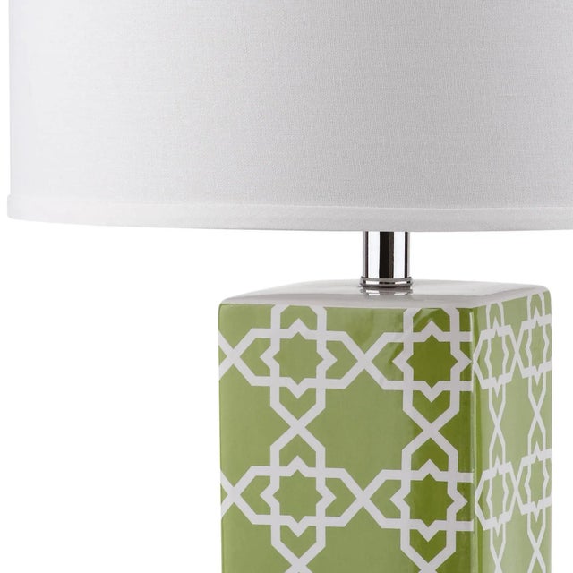 Bring a burst of color and pattern into neutral rooms with the Quatrefoil table lamp by . Crafted of green and white...