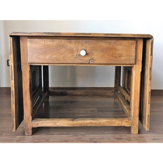 Drop-leaf table with gate-legs. This 18th century, Spanish rustic farmhouse style table features two drop leaves, gate...