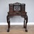 For sale is a good quality 19th century carved Padouk wood desk, having a row of small drawers, and a rectangular door...