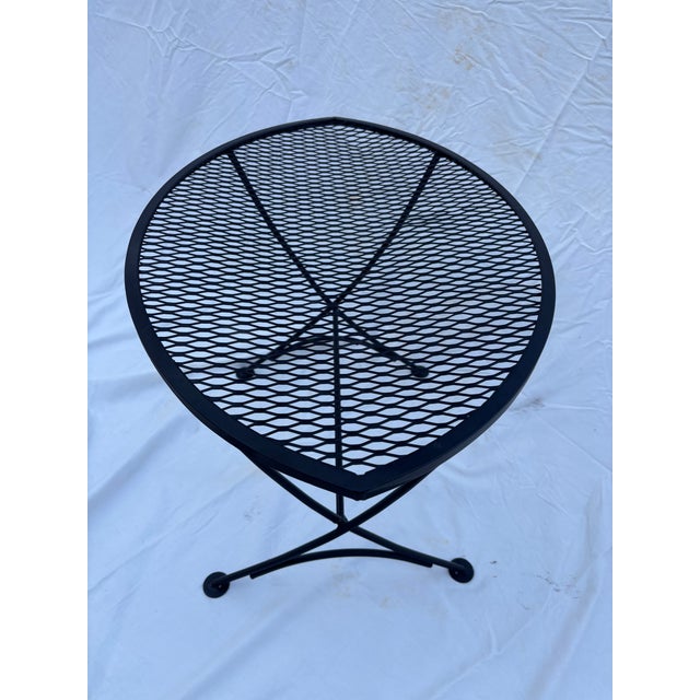 Mid Century Modern oval eye shaped outdoor patio side table by Maurizio Tempestini for Salterini cira 1960's. This wrought...