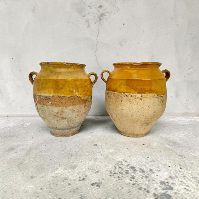 A matched pair of nineteenth-century Southern French confit or preserving pots, circa 1850–1880, hand-thrown in coarse...
