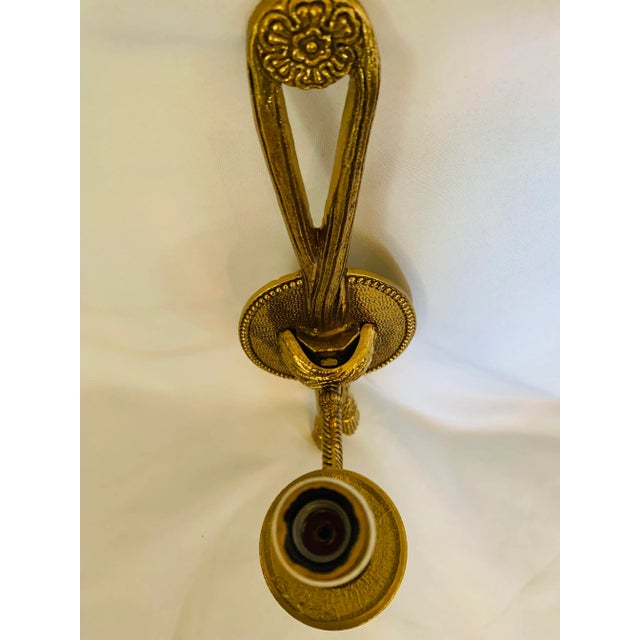 Gilt Empire-Style Gilt-Brass Tole Rope & Tassel Wall Sconce Salvaged From The Foundry L.A. This stunning sconce features a...