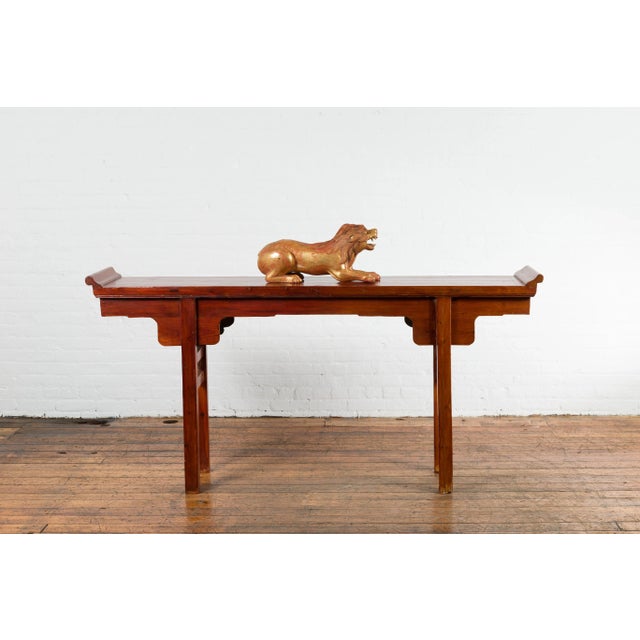 A vintage Thai gilded and carved wooden mythical creature from the mid-20th century, with red undertone. Created in...