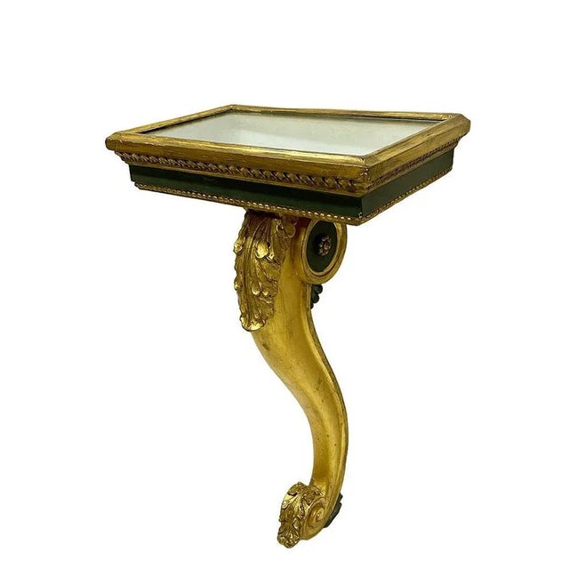Italian console tables on a cabriole leg, ca 1800 A pair of Italian console tables in rectangular shape on a gilded...