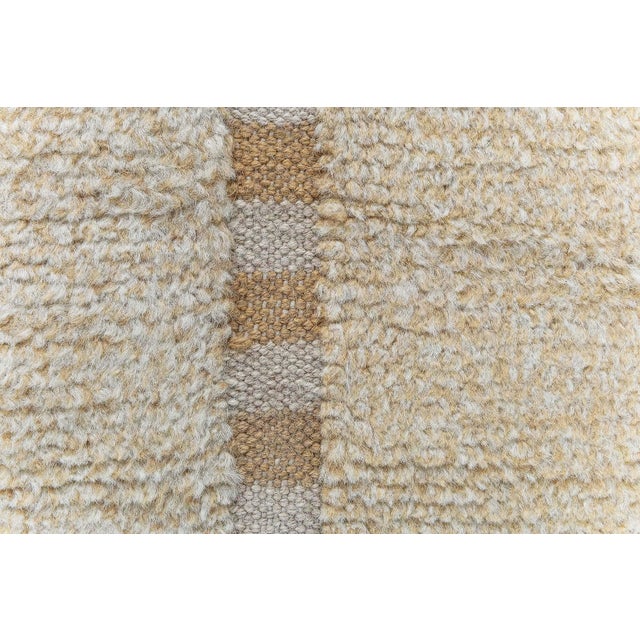 This modern Swedish half-pile rug embodies the understated elegance and tactile sophistication characteristic of...