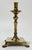 Vintage brass candleholder with exaggerated square base raised by four regal lion paw feet. Lovely patina.