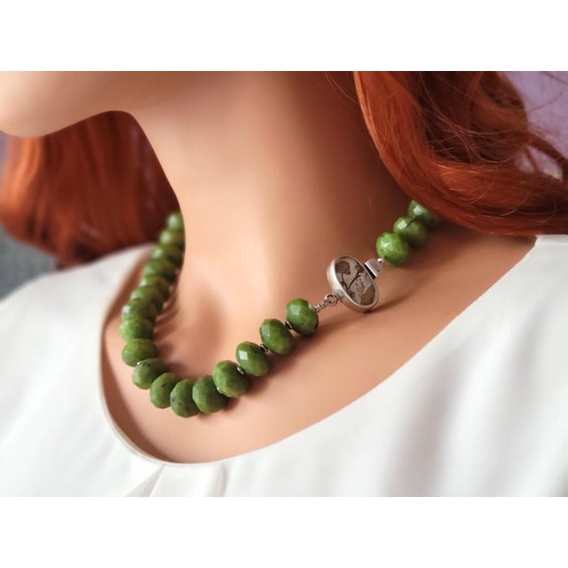 The length of the necklace is 19 inches (48 cm). The size of the faceted rondelle beads is 15 mm. The nephrite beads are...