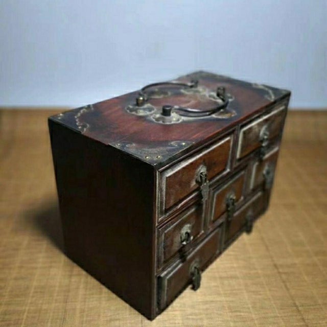 Add a touch of antique charm and functional storage to your space with this vintage Chinese apothecary cabinet, sourced...