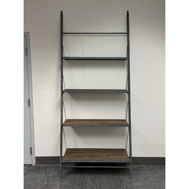 Design Plus Gallery presents the Industrial Wood & Metal Shelving Unit from Restoration Hardware. This ladder-style...