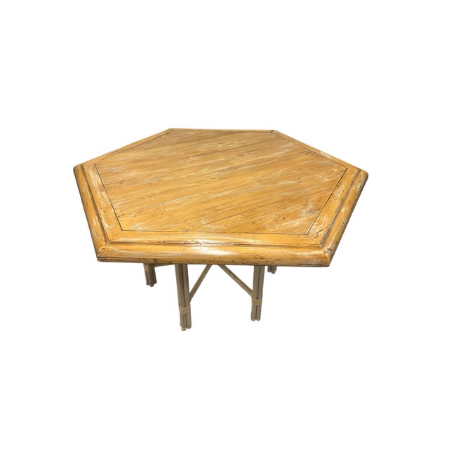 Large wooden table with rattan bottom. Seats 6 people. Chairs in are photo not included.