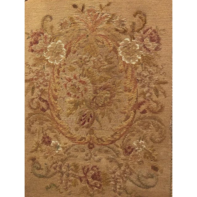 This stunning French Louis XVI carved oak fireplace screen is ca. 1900. It has an arched floral crest over a floral...