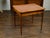A French walnut side table from the 19th century, with gilt embossed leather top, single drawer and fluted motifs. Created...