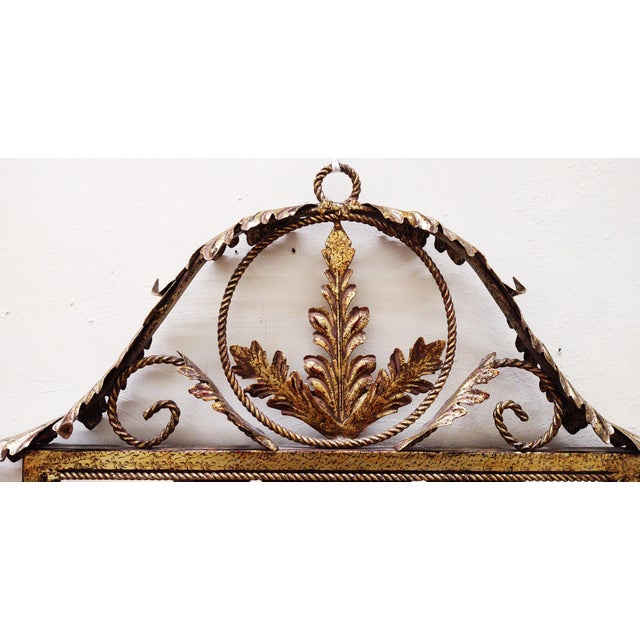 Styled after Maison Janson is this pretty piece has a scroll metal framed with gold guilded finish. Measures 24" wide x...