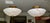 A matching pair of mid-century French Directoire-style semi-flush mount ceiling lights, crafted from solid natural white...