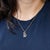 A 0.93-carat boulder opal cabochon sits at the centre of this solid 14K yellow gold pendant, framed by five earth-mined...