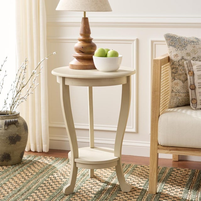 The Mary Pedestal Side Table, crafted of pine with a sabd finish, is the perfect accent for any room in need of a feminine...