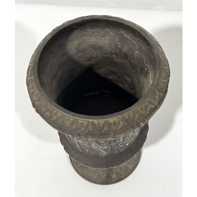 Wonderful metal urn featuring Classical figures. Great as a planter, vase, brush holder, anything!