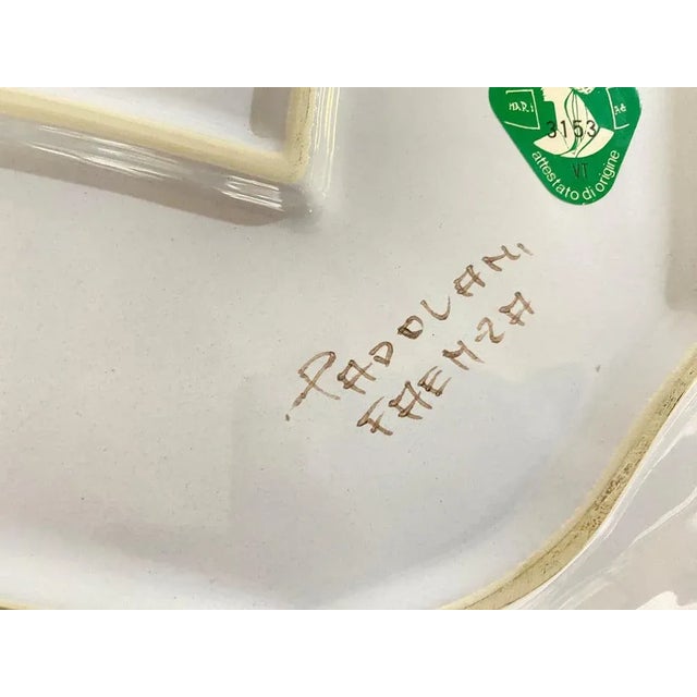 This Ceramic Dish or Charger has been done in the 1970's in Italy. Very decorative Pattern with flowers in blue, red and...