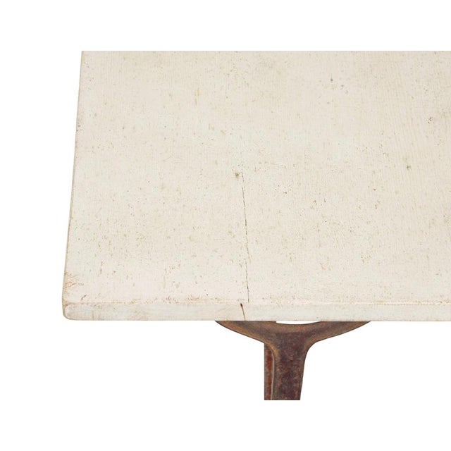 Elegant cast iron side table circa 1890. Fine table ideal for use as a sofa,side, hall or lamp table. Ornate base which...