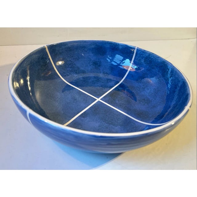 Danish ceramic fruit bowl or centerpiece featuring a 'sky-like' blue glaze highlighted with diagonal white lines and edge....