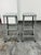 Design Plus Gallery presents a Pair of Vintage Lyon Workspace Model 1901 Industrial Barstools. Each stool has a perforated...